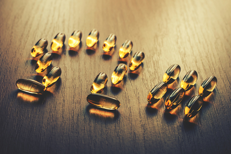 Omega three symbol in fish oil tablets.
