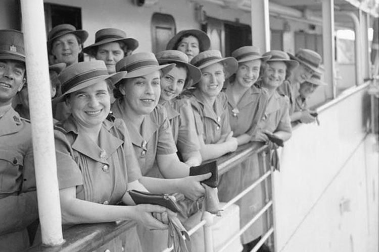 A group of Australian Army nurses wait to disembark from a hospital ship on arrival at Singapore