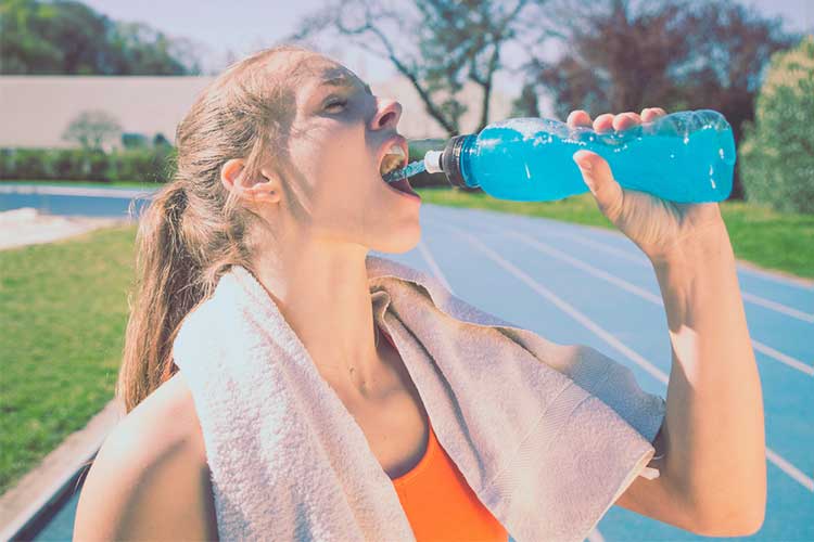 Electrolyte Imbalance: Normal Electrolyte Levels woman drinking sports drink