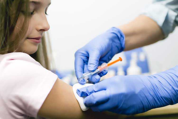 A child being given a vaccination
