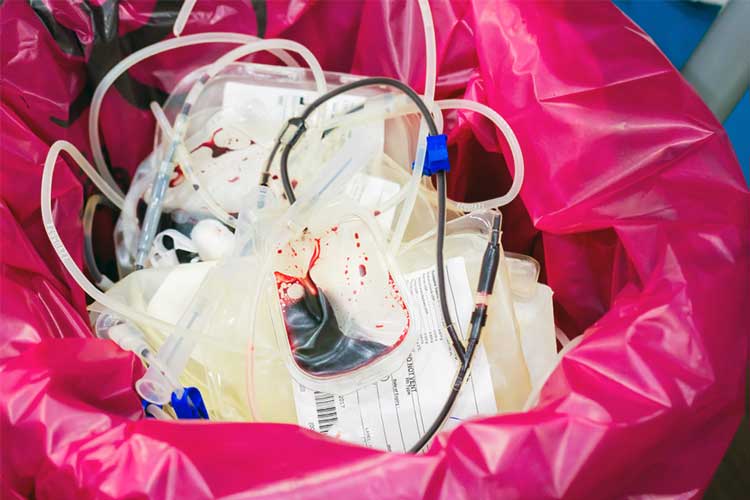 Empty blood bags in the bin