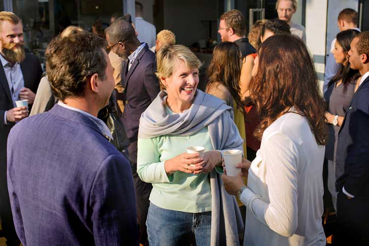 Group of people networking outside of a building