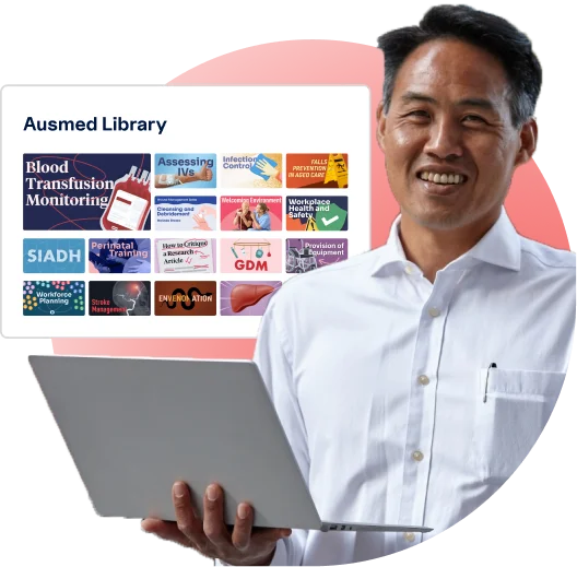 Smiling man holding laptop with floating Ausmed Library™ resources in the background, showcasing healthcare education and training content available in your LMS or Ausmed's platform.