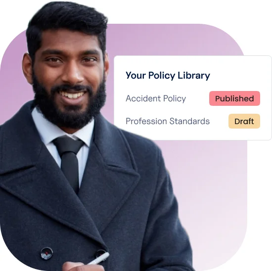 Confident healthcare administrator managing digital policy library on Ausmed, with accident policy marked as published and professional standards in draft
